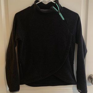 A charcoal gray "Athleta" sweatshirt